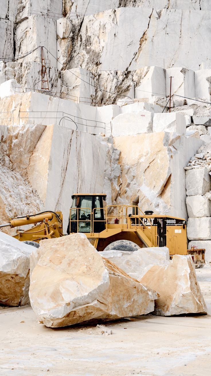Quarrying natural stone — blocks freshly cut at the quarry face